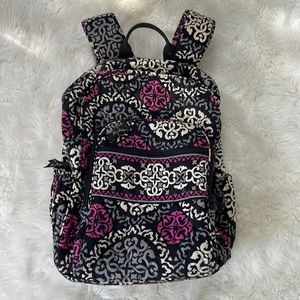 Vera Bradley backpack with 2 water/coffee pockets. 3 zippered sections.